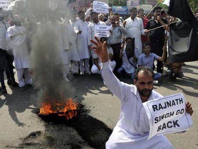 Panthers party workers raising slogans and burning tyres during a protest in Jammu. Nitin Kanotra/HT