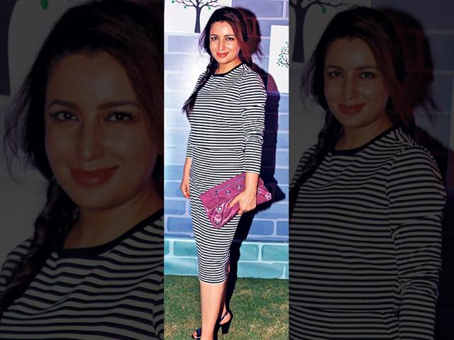 Tisca Chopra: She opted for a striped separates. A messy braid, neon pink lip, black heels and purple clutch finished her look.