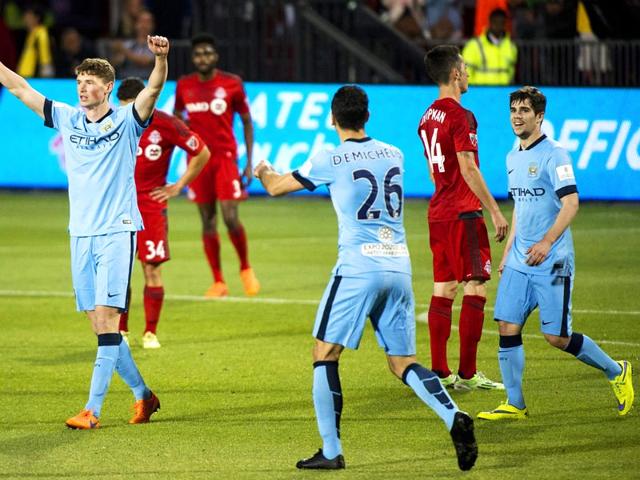 Manchester-City-midfielder-George-Evans-celebrates-his-goal-with-teammate-Martin-Demichelis-during-the-second-half-against-Toronto-FC-in-a-friendly-soccer-match-in-Toronto-AP-PHOTO Manchester-City-midfielder-George-Evans-celebrates-his-goal-with-teammate-Martin-Demichelis-during-the-second-half-against-Toronto-FC-in-a-friendly-soccer-match-in-Toronto-AP-PHOTO