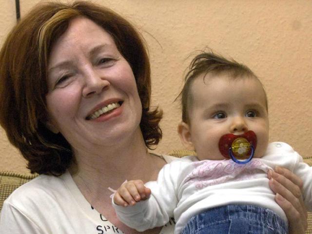 This-file-photo-taken-on-December-11-2005-shows-then-55-old-Annegret-Raunigk-1st-row-2ndL-posing-with-her-youngest-daugher-Lelia-on-her-knees-and-other-children-and-grand-children-in-Cologne-as-guest-in-a-German-channel-show-AFP-Photo This-file-photo-taken-on-December-11-2005-shows-then-55-old-Annegret-Raunigk-1st-row-2ndL-posing-with-her-youngest-daugher-Lelia-on-her-knees-and-other-children-and-grand-children-in-Cologne-as-guest-in-a-German-channel-show-AFP-Photo