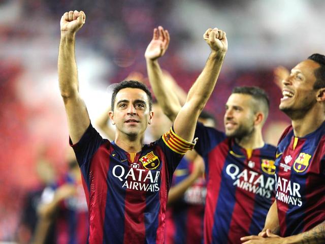 Barcelona-midfielders-Xavi-Hernandez-R-and-Andres-Iniesta-L-celebrate-with-the-trophy-after-beating-Athletic-Bilbao-in-the-Spanish-Copa-del-Rey-King-s-Cup-final-at-Camp-Nou-in-Barcelona-on-May-30-2015-AFP-Photo Barcelona-midfielders-Xavi-Hernandez-R-and-Andres-Iniesta-L-celebrate-with-the-trophy-after-beating-Athletic-Bilbao-in-the-Spanish-Copa-del-Rey-King-s-Cup-final-at-Camp-Nou-in-Barcelona-on-May-30-2015-AFP-Photo