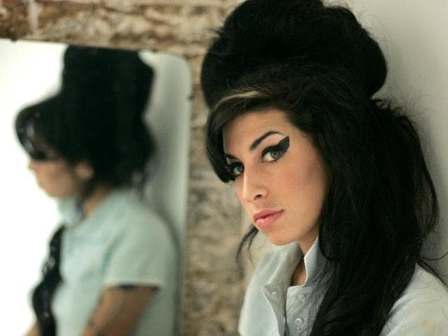 In-this-Feb-16-2007-file-photo-British-singer-Amy-Winehouse-poses-for-photographs-after-being-interviewed-by-The-Associated-Press-at-a-studio-in-north-London-The-family-of-Amy-Winehouse-has-criticised-a-documentary-about-the-late-singer-that-is-due-to-have-its-premiere-at-next-month-s-Cannes-Film-Festival-A-statement-issued-Sunday-April-26-2015-by-family-spokesman-Chris-Goodman-said-director-Asif-Kapadia-s-Amy-is-misleading-and-contains-some-basic-untruths-The-statement-said-the-film-suggested-family-members-did-too-little-to-help-the-singer-who-died-in-July-2011-aged-27-after-battling-drug-and-alcohol-abuse-AP