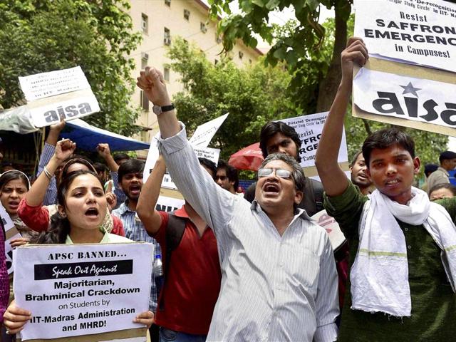 AISA-activists-holding-a-protest-against-HRD-minister-Smriti-Irani-over-derecognition-of-a-students-group-at-IIT-Madras-outside-the-Shastri-Bhavan-in-New-Delhi-on-Monday-PTI-Photo AISA-activists-holding-a-protest-against-HRD-minister-Smriti-Irani-over-derecognition-of-a-students-group-at-IIT-Madras-outside-the-Shastri-Bhavan-in-New-Delhi-on-Monday-PTI-Photo