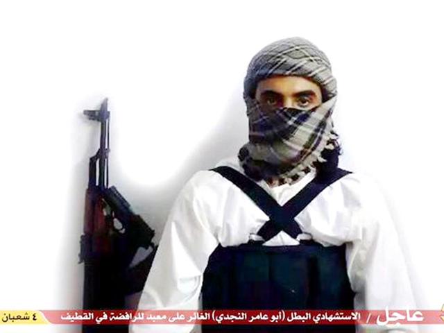 File-image-taken-from-a-militant-website-associated-with-IS-extremists-purports-to-show-a-suicide-bomber-with-the-Arabic-bar-below-reading-Urgent-The-heroic-martyr-Abu-Amer-al-Najdi-the-attacker-of-the-Shiite-temple-in-Qatif-which-the-IS-group-s-radio-station-claimed-responsibility-for-Militant-photo-via-AP