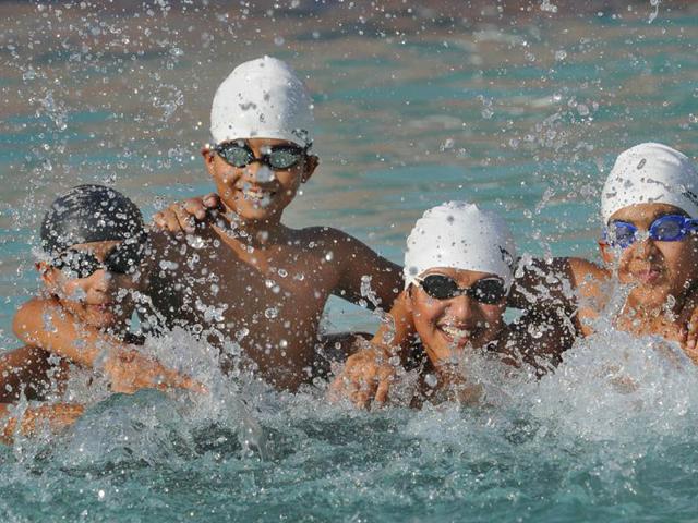 Children enjoying tswimming at PU pool in Chandigarh. Gurpreet Singh/HT