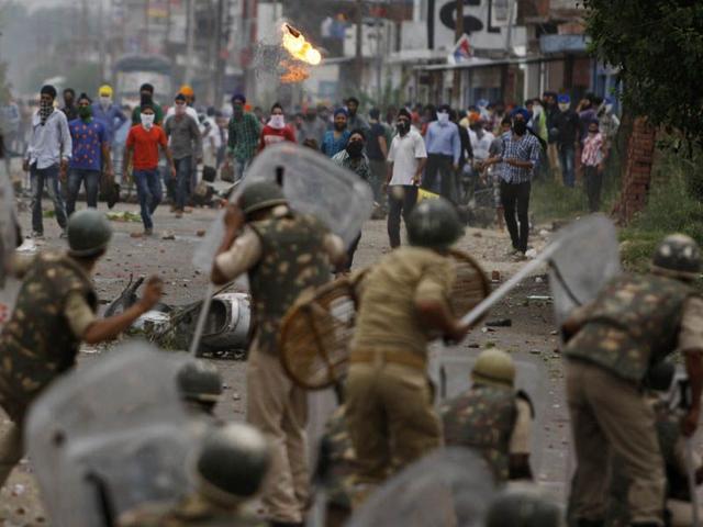 Sikh protesters throwing petrol bomb at police during a protest in Jammu. Photo courtesy: AP