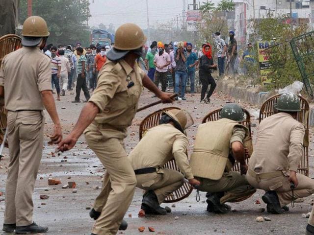 Police personnel in action against Sikh protesters during a clash which broke out after the police removed a poster of Jarnail Singh Bhindranwale in Jammu. Photo courtesy: PTI