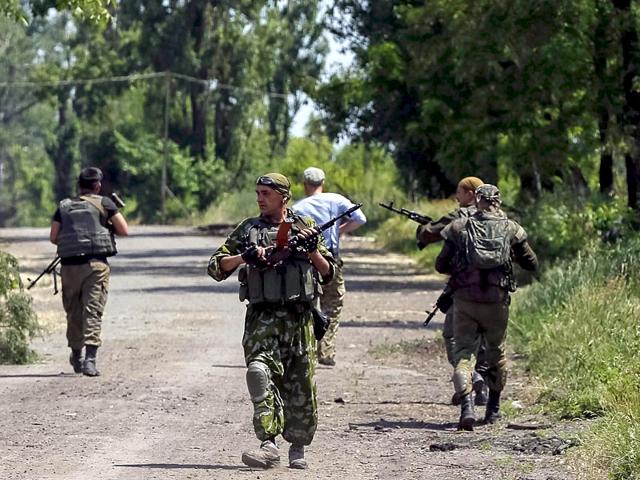 Members of the Ukrainian armed forces patrol an area in the town of Maryinka. (Reuters)
