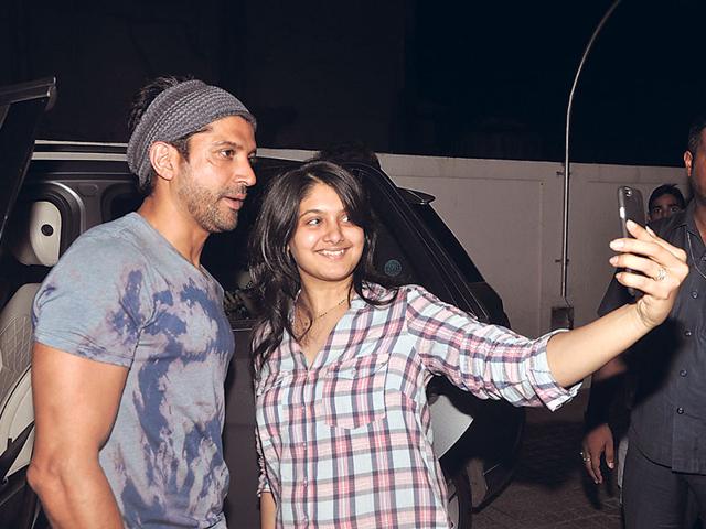 Farhan Akhtar poses for a selfie with a fan in Mumbai. (Photo: Yogen Shah)