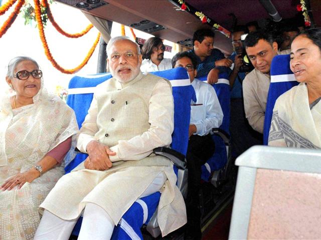 Prime Minister Narendra Modi, his Bangladeshi counterpart Sheikh Hasina and West Bengal chief minister Mamata Banerjee sitting in a bus at the flag off ceremony of bus services between Bangladesh and India, in Dhaka . PTI Photo