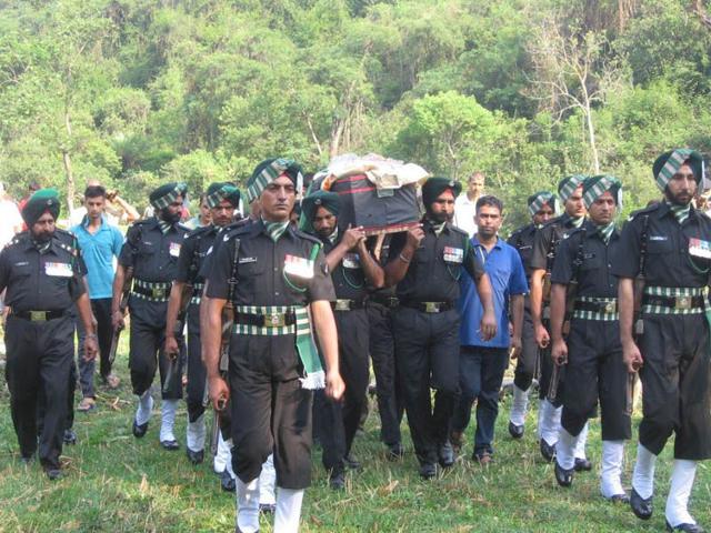 Army jawans and officers carry the coffin of soldier Vikas bhardwaj who was killed in ambush in Manipur, during his cremation in Jammu on Sunday. Birbal Sharma/HT