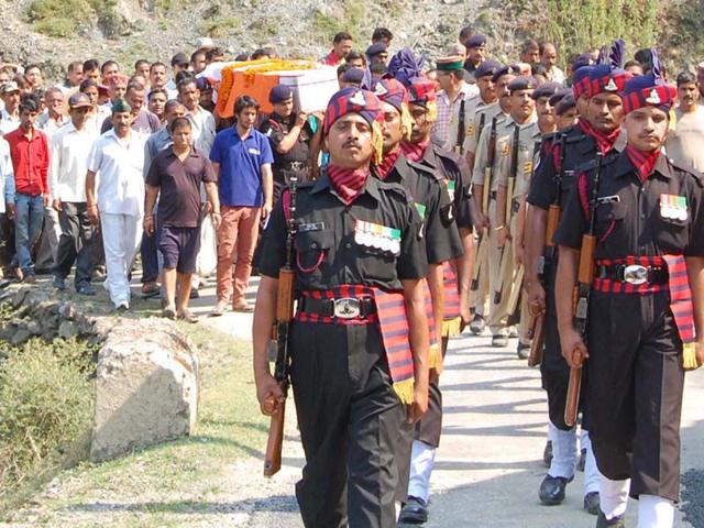 Army jawans and officers carry the coffin of soldier Vikas bhardwaj, who was killed in ambush in Manipur, during his cremation in Jammu on Sunday. Birbal Sharma/HT