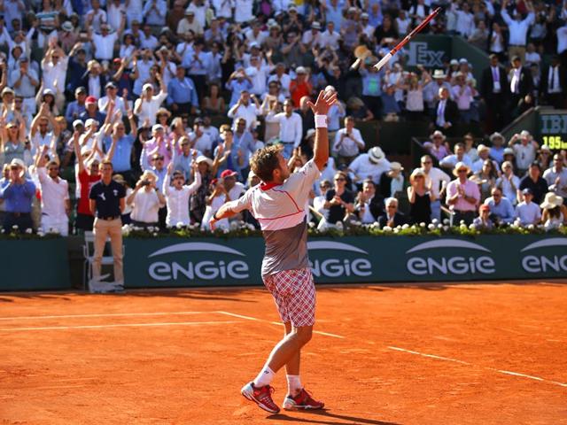 Switzerland's Stan Wawrinka throws his racquet in the air as he celebrates winning the men's final of the French Open in four sets, 4-6, 6-4, 6-3, 6-4, against Serbia's Novak Djokovic, in Paris, France. (AP Photo)