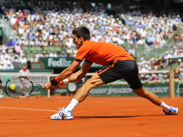 Serbia's Novak Djokovic returns the ball to Switzerland's Stan Wawrinka during the men's singles final of the French Open in Paris, France. (AP Photo)