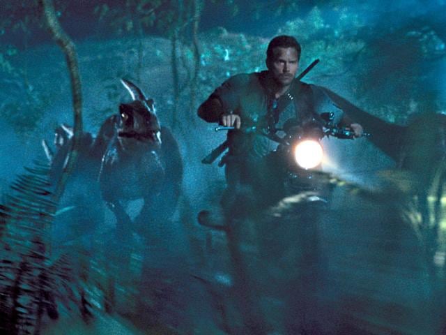 The dinosaurs are genetically-modified and computer-animated to be more terrifying than ever. Check out these trained raptors with Chris Pratt. (Photo: Universal Pictures)