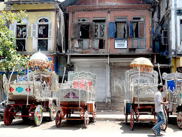 The silver-coloured Victorias -- styled on open carriages used during Queen Victoria's reign -- have been plying Mumbai's streets since British colonial times, and for years have been a tourist attraction. (AFP photo)
