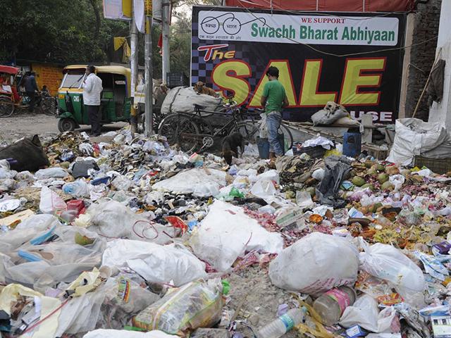 Garbage was dumped on the main road at Jheel Chowk by MCD Workers as a form of protest for not getting salaries for the past three months, in East Delhi. (Sonu Mehta/ HT Photo)