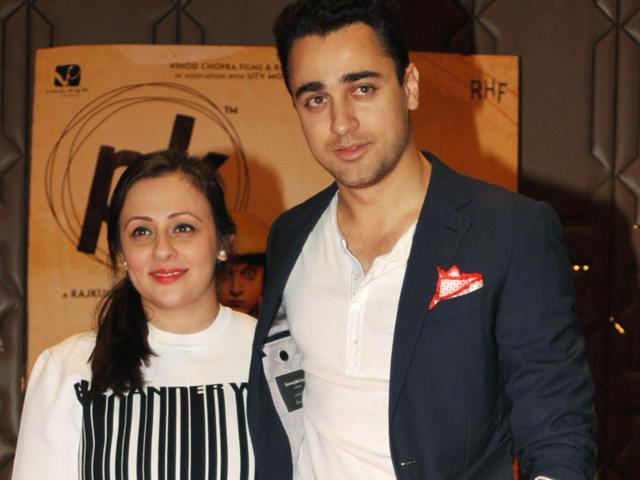 Imran Khan (R) poses for a photograph with his wife during a promotional event for the Hindi film 'PK', directed by Rajkumar Hirani and produced by Hirani and Vidhu Vinod Chopra, in Mumbai on late June 10, 2015. (Photo: AFP)