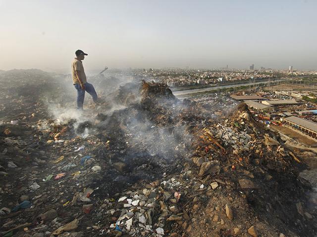 Residents want more proactive action to be taken against this 70-acre dump, which is as tall as a 10-storey building. (Virendra Singh Gosain/HT Photo)
