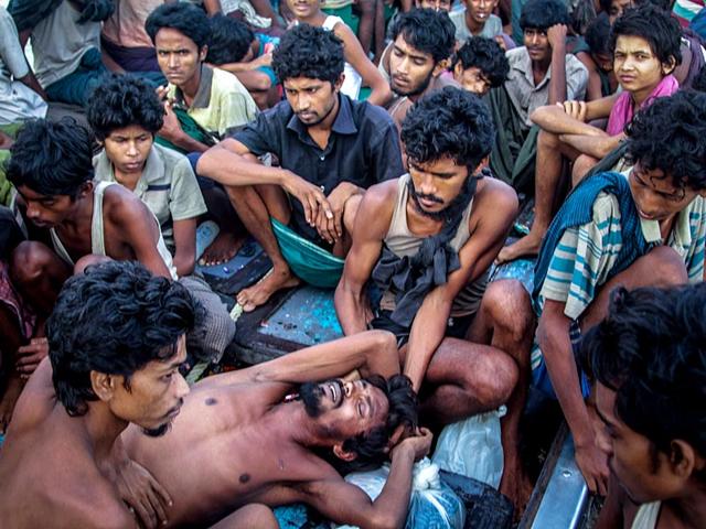 Rohingya-migrants-resting-on-a-boat-in-Indonesia-before-being-rescued-AFP-Photo
