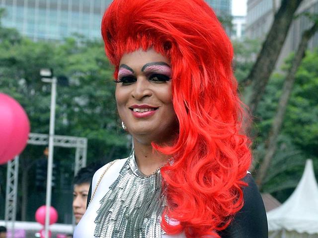 A participant dressed in pink poses for a photograph at the annual "Pink Dot" event in a public show of support for the LGBT community at Hong Lim Park in Singapore.(AFP Photo)