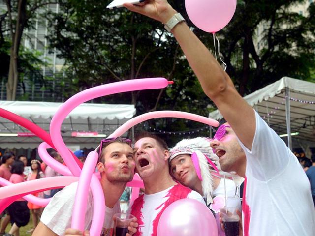 Participants dressed in pink pose for a group "selfie" at the annual "Pink Dot"(AFP Photo)