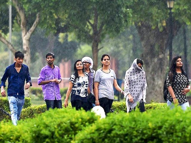 The showers got out the happy spirits of people. (PTI Photo)