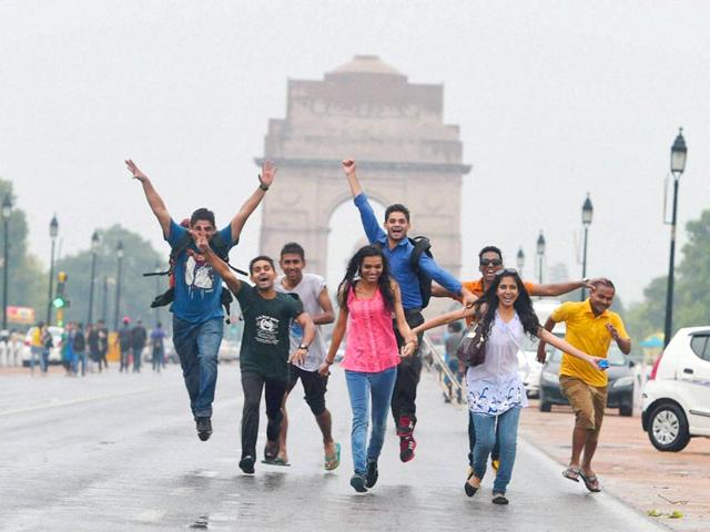 Youngsters enjoying the pre-monsoon showers at India Gate. (PTI Photo)