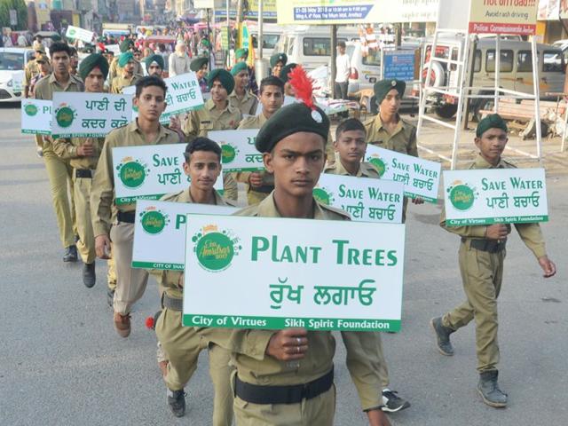 Students and NCC cadets holding placards as they participate in an awareness march to mark the 438th Amritsar Foundation Day. Sameer Sehgal/HT