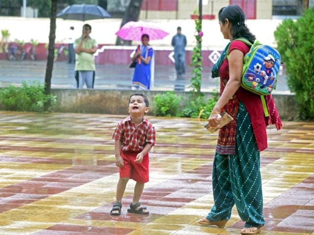 This tiny tot was in tears on the first day of school at Bhayander's Our Lady of Nazareth School and his mom waited for him patiently to stop crying... (Pratham Gokhale/HT photo)