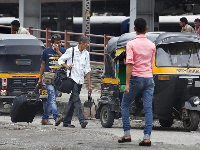 People wait for taxi outside Bandra Terminus railway station as auto-rickshaws and taxi drivers attached with 'Swabhiman Union' go on a day-long strike in Mumbai. (Vijayanand Gupta/ HT Photo)
