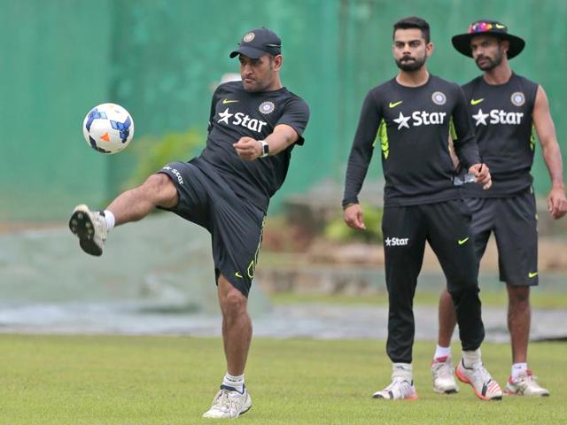 MS-Dhoni-plays-with-a-football-as-teammates-Virat-Kohli-and-Shikhar-Dhawan-watch-during-a-practice-session-on-June-17-a-day-ahead-of-India-s-one-day-international-cricket-match-against-Bangladesh-AP-Photo MS-Dhoni-plays-with-a-football-as-teammates-Virat-Kohli-and-Shikhar-Dhawan-watch-during-a-practice-session-on-June-17-a-day-ahead-of-India-s-one-day-international-cricket-match-against-Bangladesh-AP-Photo