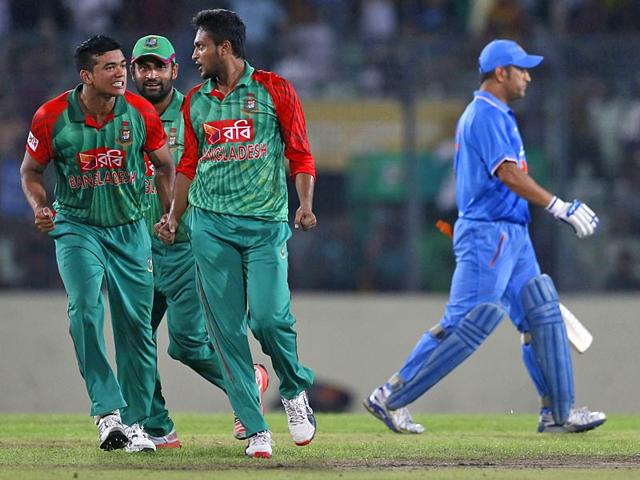 Bangladesh-players-congratulate-teammate-Mustafizur-Rahman-3L-after-the-seamer-dismissed-an-Indian-batsman-during-the-second-ODI-match-between-Bangladesh-and-India-in-Dhaka-on-June-21-2015-AFP-Photo Bangladesh-players-congratulate-teammate-Mustafizur-Rahman-3L-after-the-seamer-dismissed-an-Indian-batsman-during-the-second-ODI-match-between-Bangladesh-and-India-in-Dhaka-on-June-21-2015-AFP-Photo