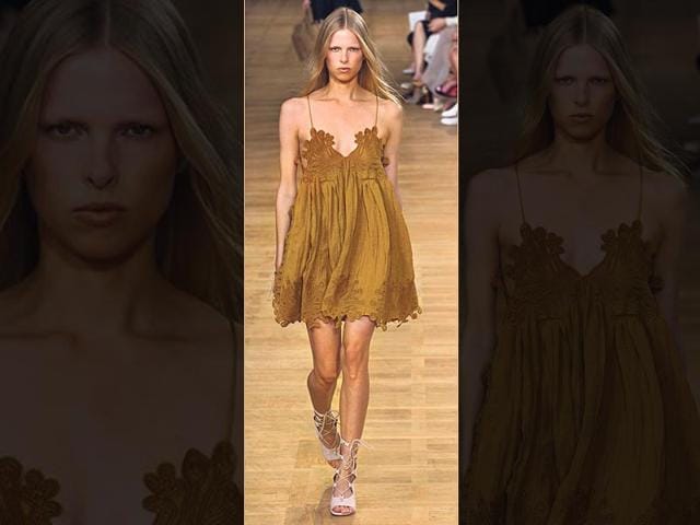 Dare to bare: Want to beat the heat? Rock a slip dress in a babydoll-esque length with dainty cut outs just like this mustard number by French fashion house Chloé. (AFP Photo)