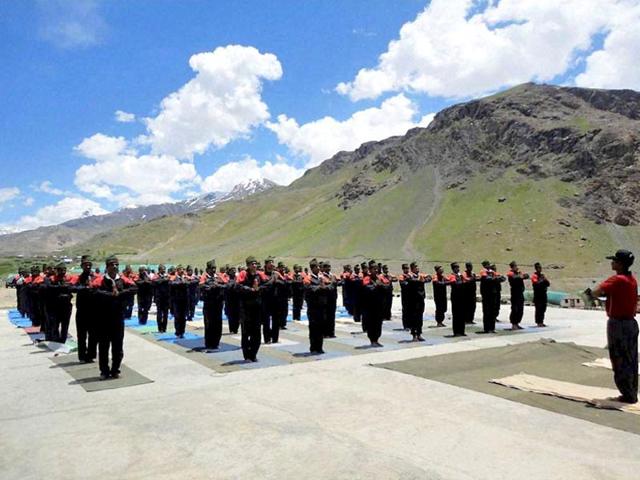 Army personnel practice yoga at Northern Command on the eve of International Yoga Day in Ladakh. (PTI Photo)