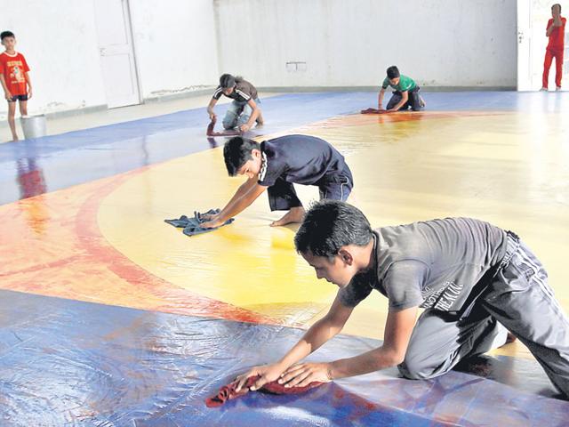 While-athletes-from-Haryana-have-won-laurels-at-the-Olympics-at-the-grassroots-the-state-lacks-facilities-Lack-of-basics-like-drinking-water-at-Hisar-s-Agroha-stadium-had-brought-the-number-of-PYKKA-Panchayat-Yuva-Krida-and-Khel-Abhiyan-trainees-down-to-80-in-2012-Players-had-to-clean-the-indoor-hall-themselves-as-there-was-no-caretaker-HT-File-Photo While-athletes-from-Haryana-have-won-laurels-at-the-Olympics-at-the-grassroots-the-state-lacks-facilities-Lack-of-basics-like-drinking-water-at-Hisar-s-Agroha-stadium-had-brought-the-number-of-PYKKA-Panchayat-Yuva-Krida-and-Khel-Abhiyan-trainees-down-to-80-in-2012-Players-had-to-clean-the-indoor-hall-themselves-as-there-was-no-caretaker-HT-File-Photo