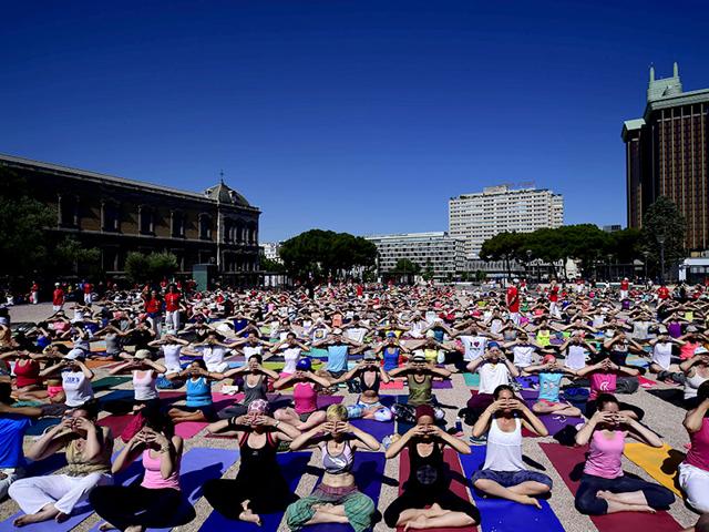 International Yoga Day being celebrated at Colon square in Madrid. (AFP Photo)