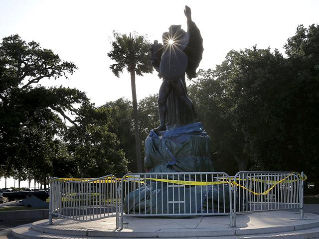 A tarp covers the base of the monument "To the Confederate defenders of Charleston" in White Park Garden in Charleston, South Carolina. (Reuters)