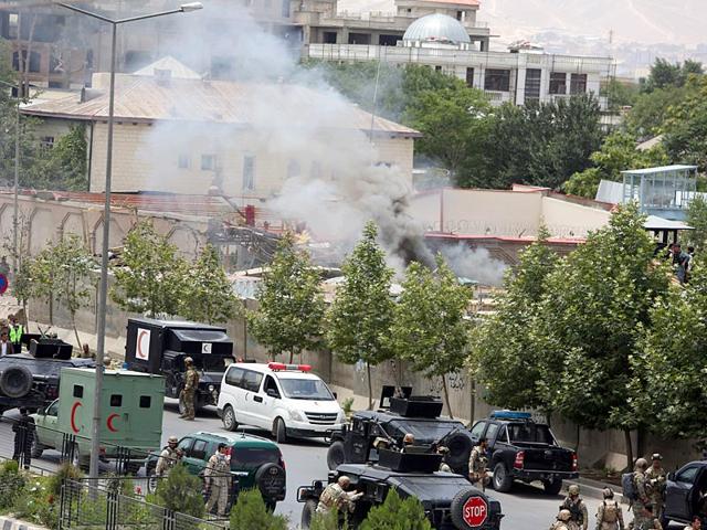 Smoke rises at the site of a suicide attack during clashes with Taliban fighters in front of the Parliament in Kabul. (AP Photo)