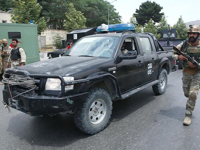 Afghan security forces take positions at the site of the suicide attack. (AP Photo)