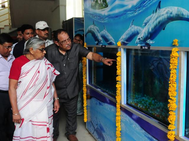 Fisheries minister Kusum Mehdale takes a round of the new aquarium set up at Bhadbhada in Bhopal on Tuesday. (Mujeeb faruqui/HT photo)