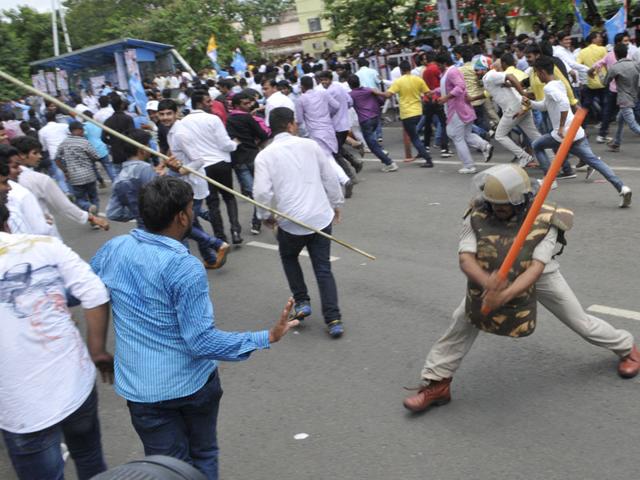 Police cane charge NSUI activists during their demonstration against irregularities in DMAT exam, in Bhopal on Tuesday. (Praveen Bajpai/HT)