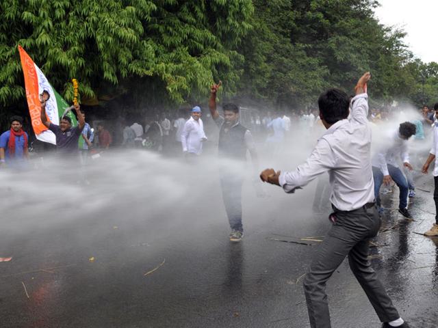 Police use water cannon to disperse NSUI protesters demonstrating against irregularities in DMAT exam, in Bhopal on Tuesday. (Praveen Bajpai/HT)