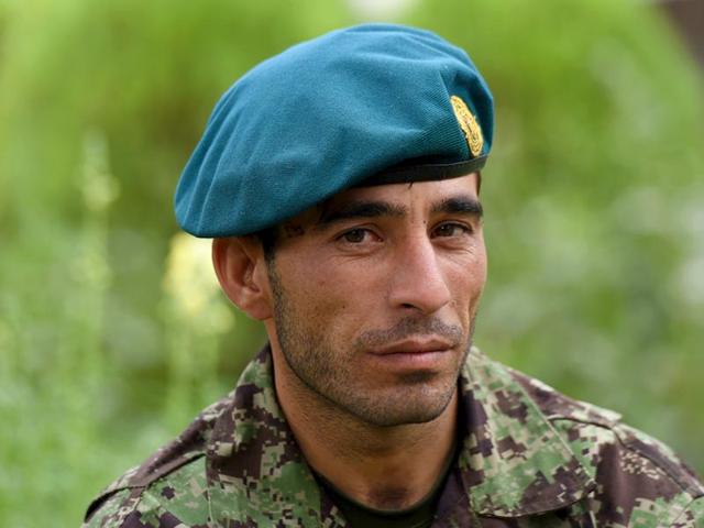 Afghan-soldier-Essa-Khan-Laghmani-talks-at-the-Afghan-Parliament-compound-in-Kabul-AFP-Photo