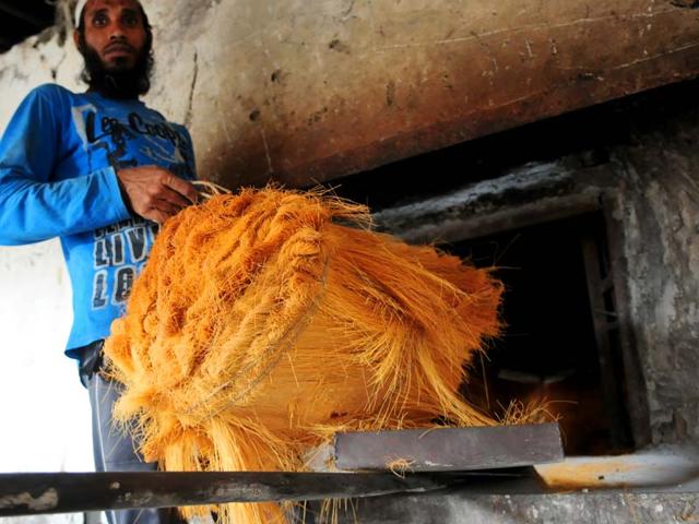A worker carrying Sewaiyan or vermicelli from a bakery oven, in Bhopal, India. (Mujeeb faruqui/Hindustan Times)
