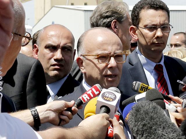 French-Interior-Minister-Bernard-Cazeneuve-answers-reporters-after-an-attack-took-place-in-Saint-Quentin-Fallavier-southeast-of-Lyon-France-France-immediately-opened-a-terrorism-investigation-AP-Photo French-Interior-Minister-Bernard-Cazeneuve-answers-reporters-after-an-attack-took-place-in-Saint-Quentin-Fallavier-southeast-of-Lyon-France-France-immediately-opened-a-terrorism-investigation-AP-Photo