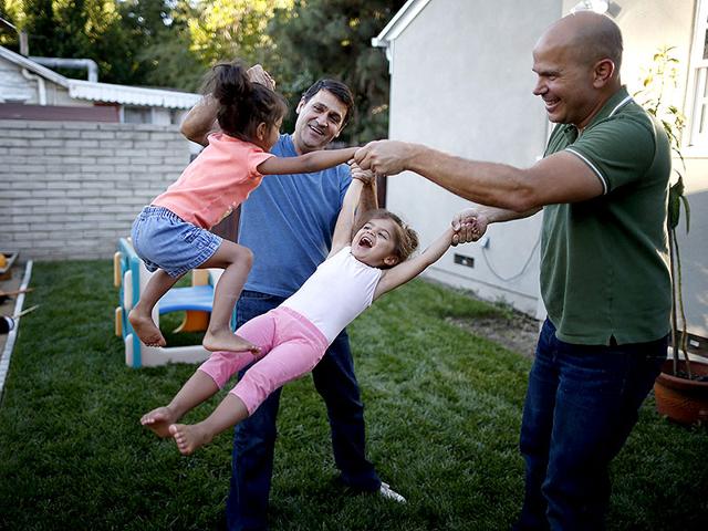 Jason-Howe-R-and-his-husband-Adrian-Perez-Boluda-play-with-their-twin-three-year-old-daughters-at-their-home-in-California-United-States-Howe-and-Perez-Boluda-married-in-Spain-and-in-California-in-2008-The-US-Supreme-Court-ruled-on-Friday-that-the-US-Constitution-provides-same-sex-couples-the-right-to-marry-in-a-historic-triumph-for-the-American-gay-rights-movement--Reuters-Photo Jason-Howe-R-and-his-husband-Adrian-Perez-Boluda-play-with-their-twin-three-year-old-daughters-at-their-home-in-California-United-States-Howe-and-Perez-Boluda-married-in-Spain-and-in-California-in-2008-The-US-Supreme-Court-ruled-on-Friday-that-the-US-Constitution-provides-same-sex-couples-the-right-to-marry-in-a-historic-triumph-for-the-American-gay-rights-movement--Reuters-Photo