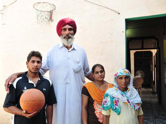 Family members of basketball player Satnam Singh at village Ballo Ke, Barnala Punjab on Friday. Keshav Singh/HT