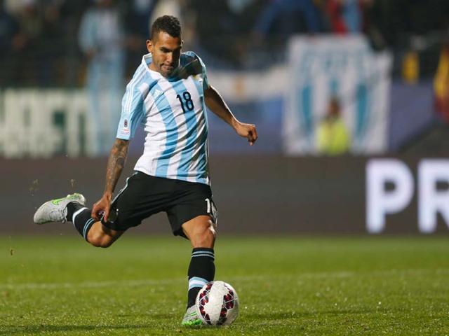 Argentina-s-Carlos-Tevez-scores-the-winning-penalty-kick-during-the-Copa-America-quarter-final-soccer-match-against-Colombia-at-the-Sausalito-Stadium-in-Vina-del-Mar-Chile-on-June-26-2015-Argentina-won-the-shootout-5-4-AP-Photo Argentina-s-Carlos-Tevez-scores-the-winning-penalty-kick-during-the-Copa-America-quarter-final-soccer-match-against-Colombia-at-the-Sausalito-Stadium-in-Vina-del-Mar-Chile-on-June-26-2015-Argentina-won-the-shootout-5-4-AP-Photo
