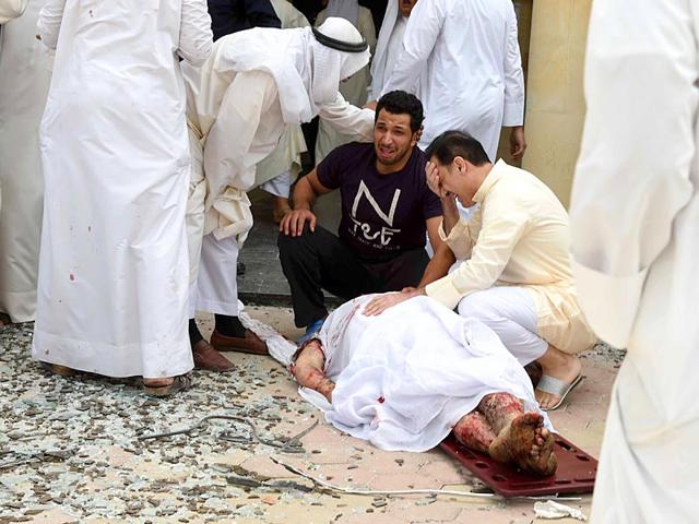 Kuwaiti-men-react-over-a-body-at-the-site-of-a-suicide-bombing-that-targeted-the-Shiite-Al-Imam-al-Sadeq-mosque-after-it-was-targeted-by-a-suicide-bombing-during-Friday-prayers-on-June-26-2015-in-Kuwait-City-The-IS-group-affiliated-group-in-Saudi-Arabia-calling-itself-Najd-Province-claimed-the-attack-AFP-Photo Kuwaiti-men-react-over-a-body-at-the-site-of-a-suicide-bombing-that-targeted-the-Shiite-Al-Imam-al-Sadeq-mosque-after-it-was-targeted-by-a-suicide-bombing-during-Friday-prayers-on-June-26-2015-in-Kuwait-City-The-IS-group-affiliated-group-in-Saudi-Arabia-calling-itself-Najd-Province-claimed-the-attack-AFP-Photo